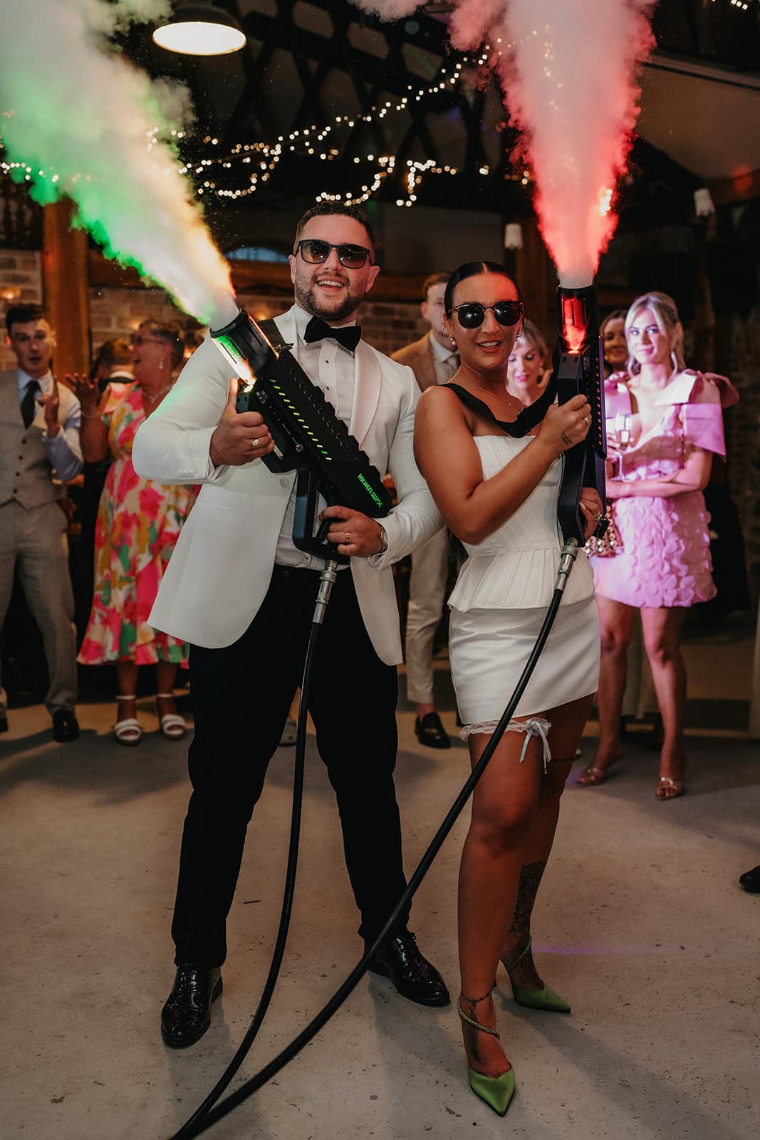 Newlyweds holding and blasting Co2 Guns at Northern Ireland Wedding